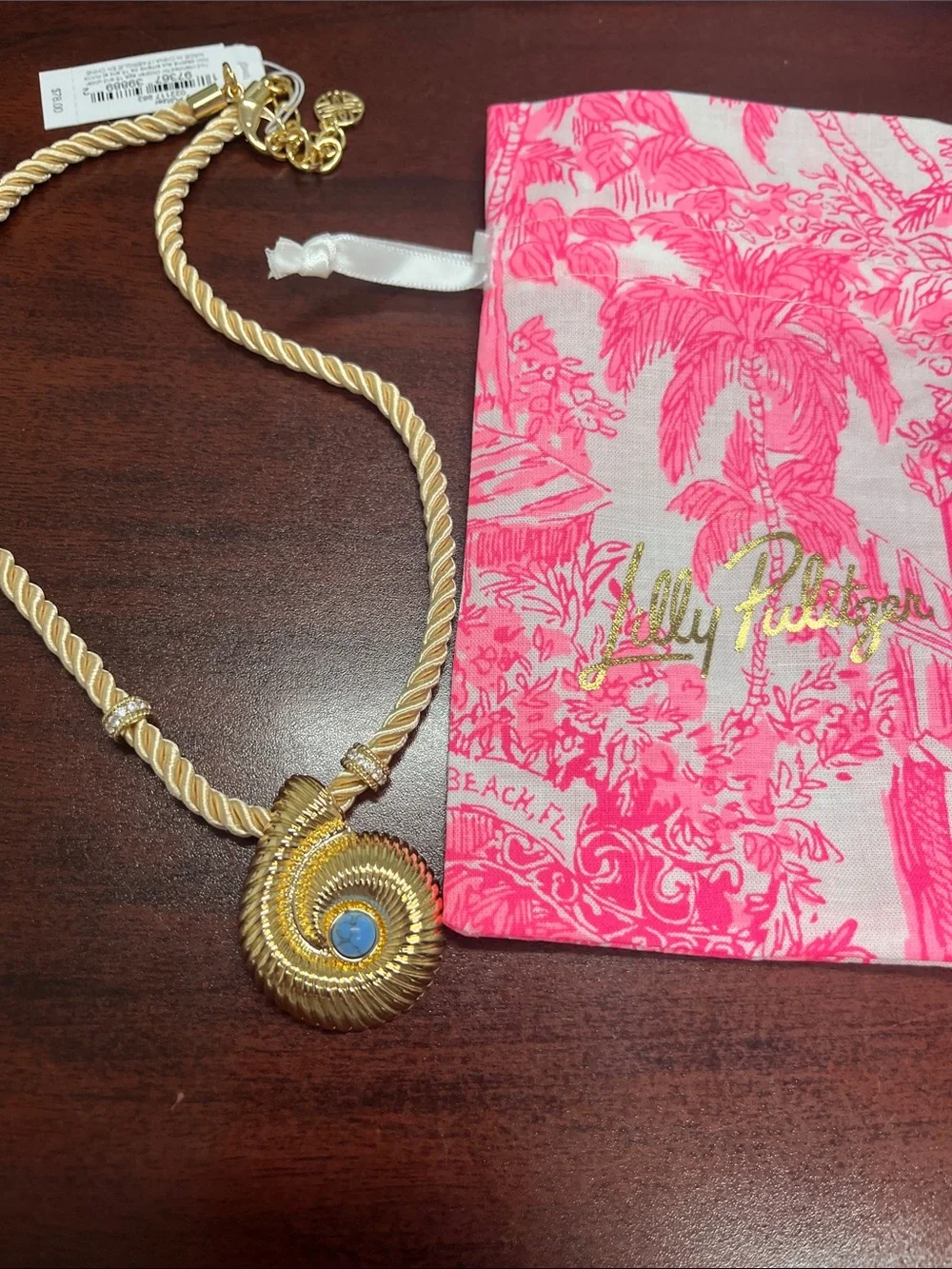 Lilly Pulitzer gold shell with blue stone! Gold cord with accents. Beautiful.